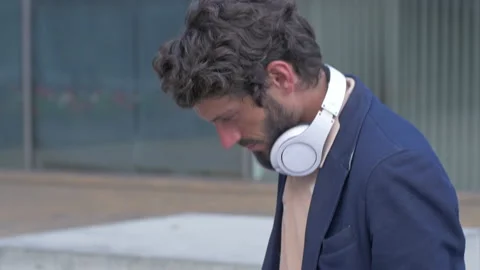 Young stylish man using a tablet outdoors in the city Stock Footage 132934894