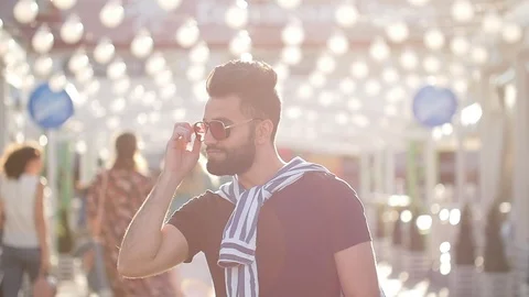 Young stylish smiling arabic or latin young man on a city street Stock Footage 111935337