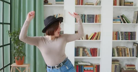 Young stylish woman dancing at home having  funny dance moves Stock Footage 130855053