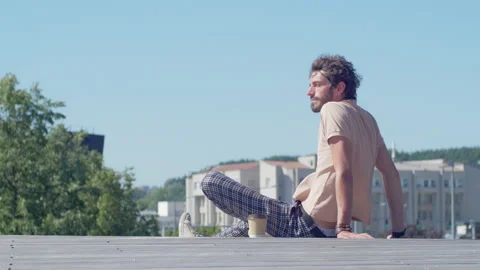 Young stylish worker taking a coffee break outdoors Stock Footage 132836391