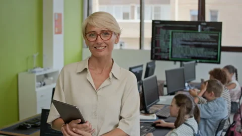 Young Successful Female Teacher of Programming School Looking at Camera Video stock 316478629