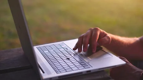 Young successful freelancer using his laptop computer outdoors. Stock Footage 159621550