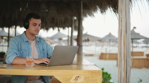 Young successful man freelancer typing and coding on laptop while enjoying in Video stock 178470350