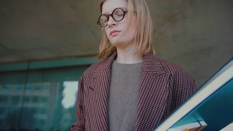 Young successful manager in glasses checking phone new business communication Stock Footage 104683597