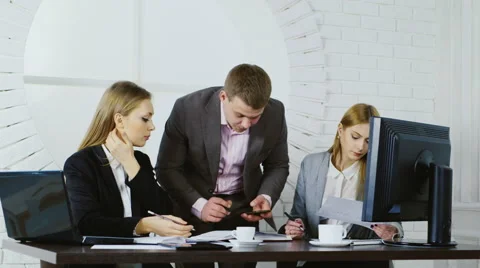 Young successful people working together in the office Stock Footage 65566237
