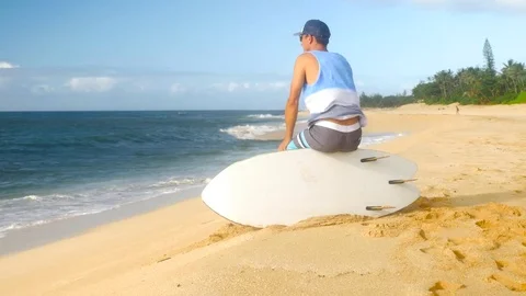 Young surfer on the beach waiting for perfect waves Stock Footage 71837165