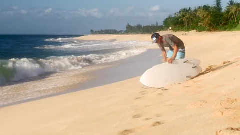 Young surfer on the beach waiting for perfect waves Stock Footage 71837188