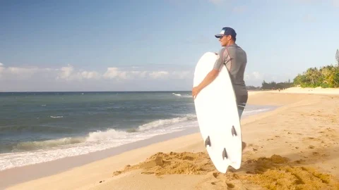 Young surfer on the beach waiting for perfect waves Stock Footage 71837212