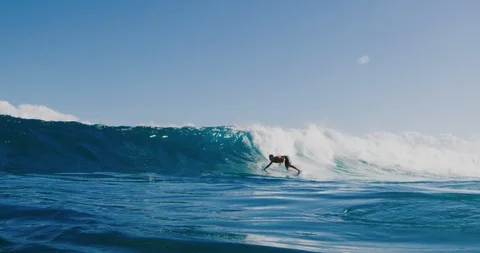 Young surfer ripping in gnarly waves Stock Footage 105753320
