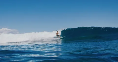 Young surfer ripping in gnarly waves Stock Footage 105753904
