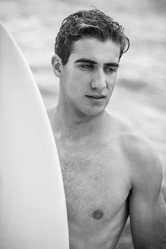 Young surfer with surfboard Stock-Fotos