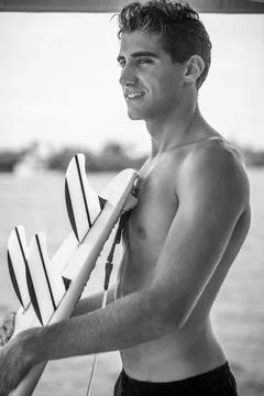 Young surfer with surfboard Stock Photos