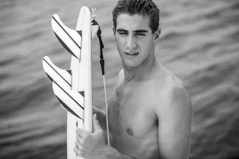 Young surfer with surfboard Stock Photos