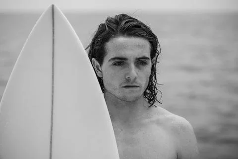 Young surfer with surfboard Stock Photos