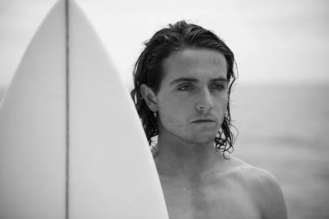 Young surfer with surfboard Stock Photos