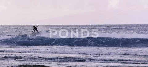 Young surfers takes the waves, vintage style photography. Stock Photos