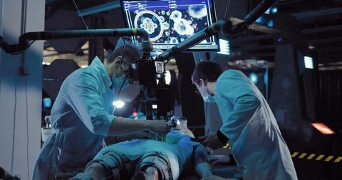 Young surgeon studies the insides of an alien creature. Laboratory technician Stock Footage 103868765