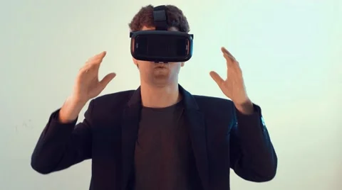 Young surprised man plays some virtual reality games Stock Footage 63188123