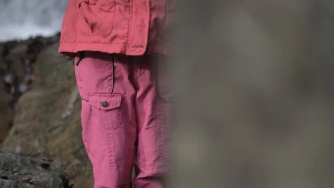 Young sweet girl using smart phone while standing in nature 動画素材 124601410