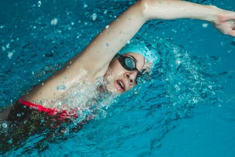 A young swimmer performs a forward crawl technique. The theme of sports and e Stock Photos