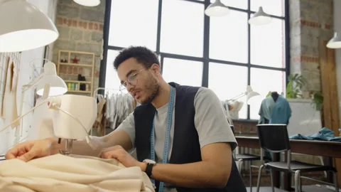 Young Tailor Using Sewing Machine in Workshop Stock Footage 263520472