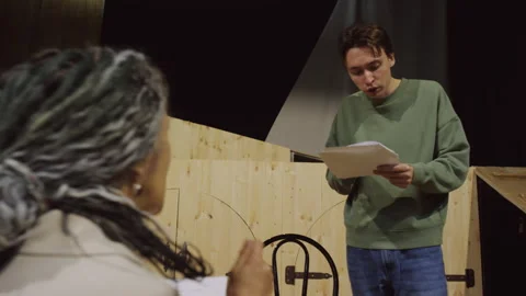 Young Talented Actor Reading Speech on Paper during Theatre Rehearsal Stock Footage 279593921