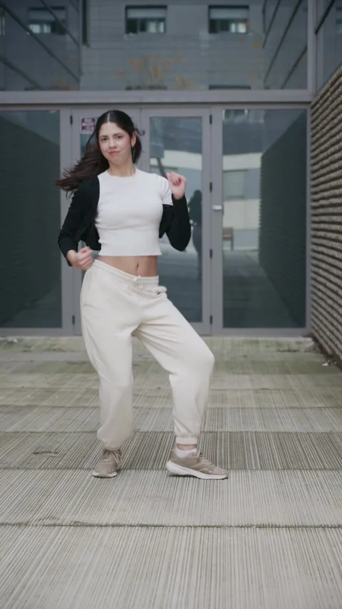 Young talented dancer performing k pop dance choreography outdoors Stock Footage 334036042