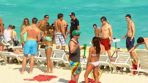 Young talking on the beach at Spring Break Stock Footage 47756444