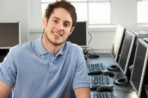 Young teacher in empty classroom Stock Photos