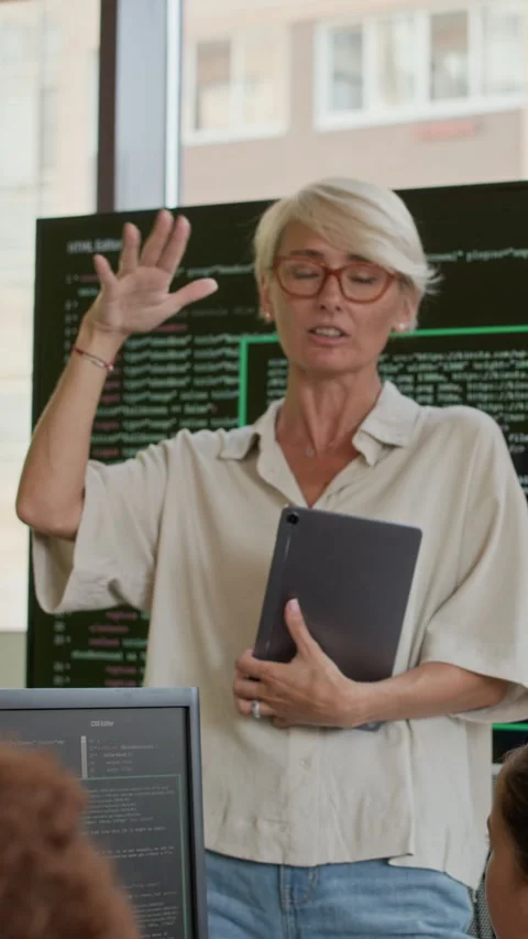 Young Teacher Explaining Kids How to Work with Programming Languages Stock Footage 316484228