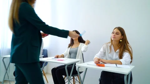 young teacher giving assignment on quest... | Stock Video | Pond5