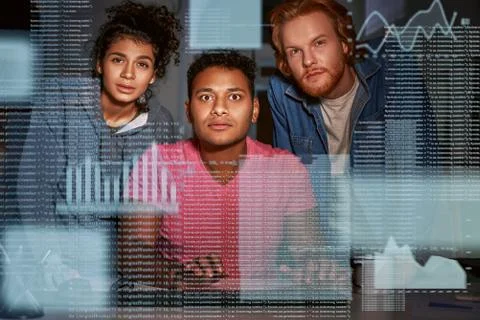 Young team of data analysts are captivated by the code Stock-Fotos