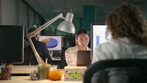 Young Team of Diverse Professionals Working Late in Modern Office Stock Footage 137519052