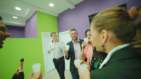 Young team drinking champagne in office Stock Footage 32276407