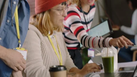Young team of engineers developing software app using digital laptop computer Stock Footage 96911272
