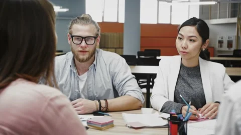 Young team of multiracial diverse colleagues developing strategy for startup Video stock 145606768