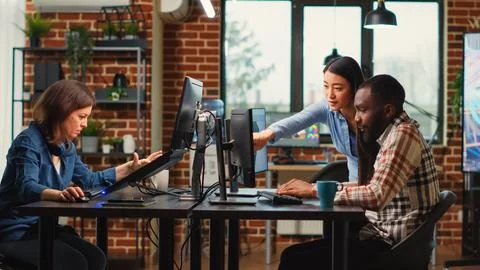 Young team of professional developers using skills Stock Photos