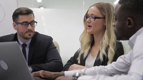 Young team of professionals work at table in leading company. Stock Footage 85375269