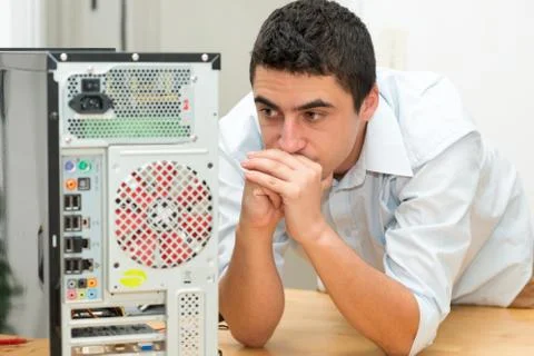 Young technician have a problem with computer 스톡 사진