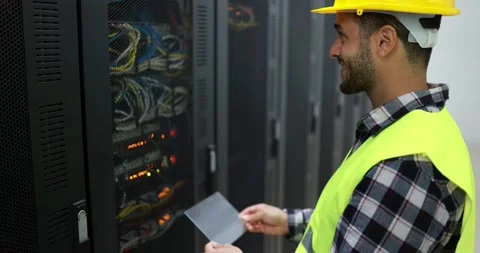 Young technician man at work installing a new rack mount server Stock Footage 149302621