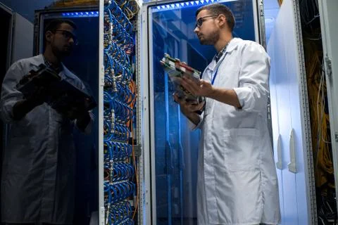 Young Technician Working with Supercomputer Foto stock