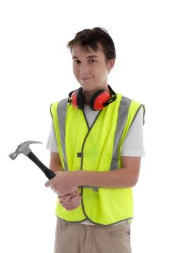 Young teen apprentice builder holding hammer Teenager holding a hammer and... Stock Photos