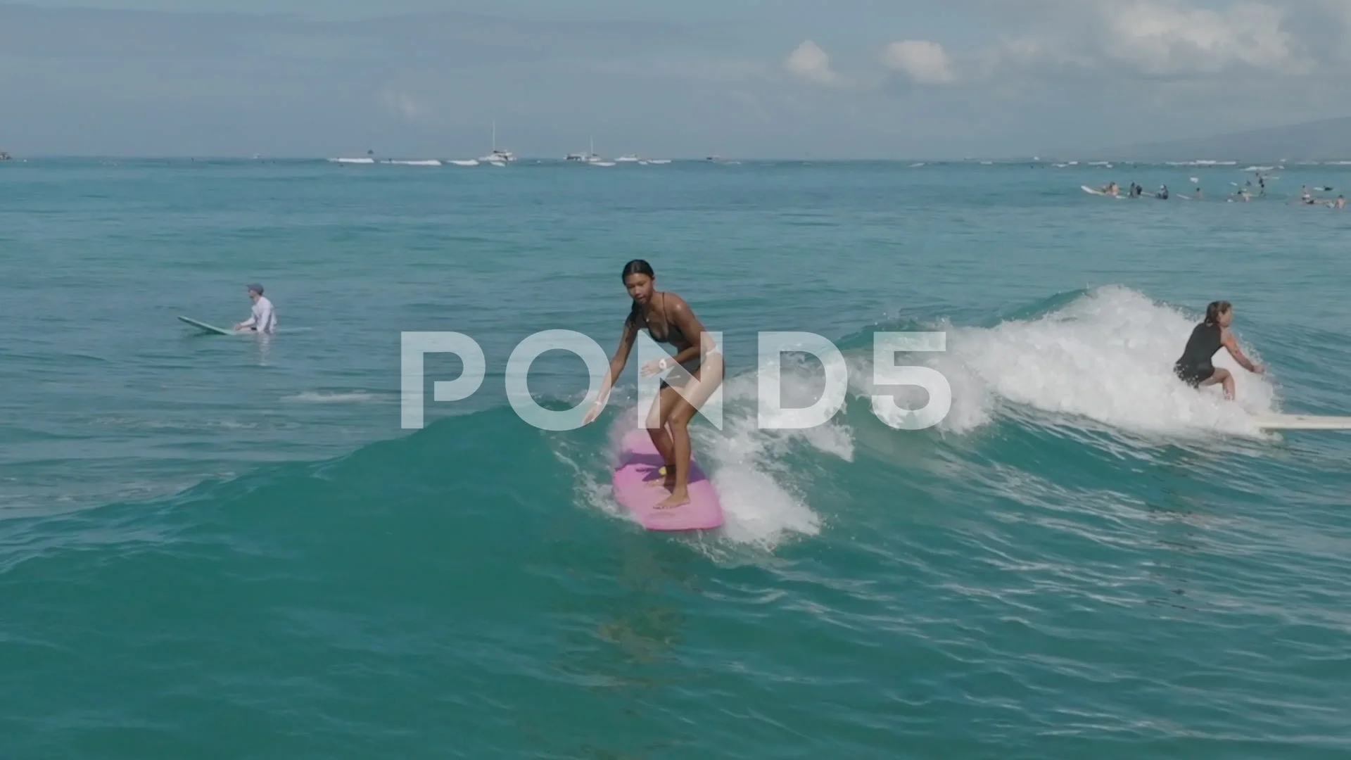 Young teen girl playing with waves at the beach.Teen girl in