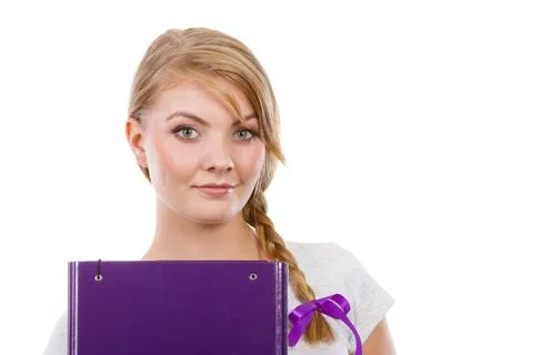 Young teenage student with braid holding books Stock Photos