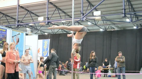 Young teenager with acrobatic program on pylon, Kiev, Ukraine, Video stock 36268305