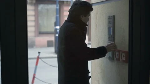 Young teenager input open code on intercome and enter apartment building Stock-Footage 87533620