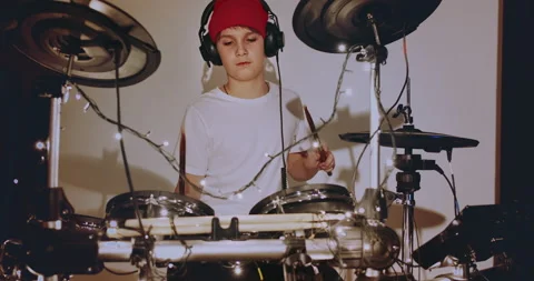 Young teenger boy learning play electronic drums music at living room at home Stock-Footage 132107267