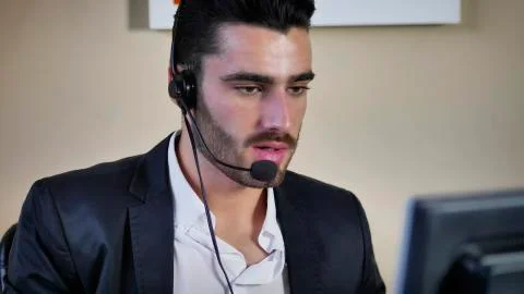 Young telemarketer, help desk assistant or customer service worker Stock Photos