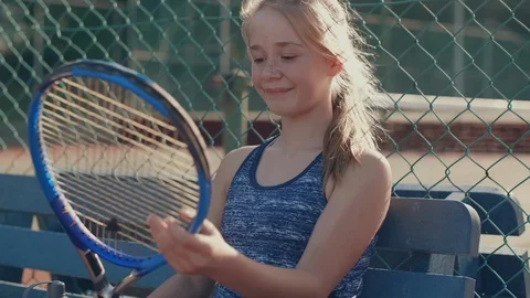 Young tennis player getting ready for training Stock Footage 93321105