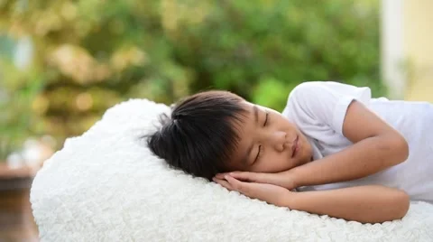 Young Thai boy sleep on the white bed 库存影片 68809484